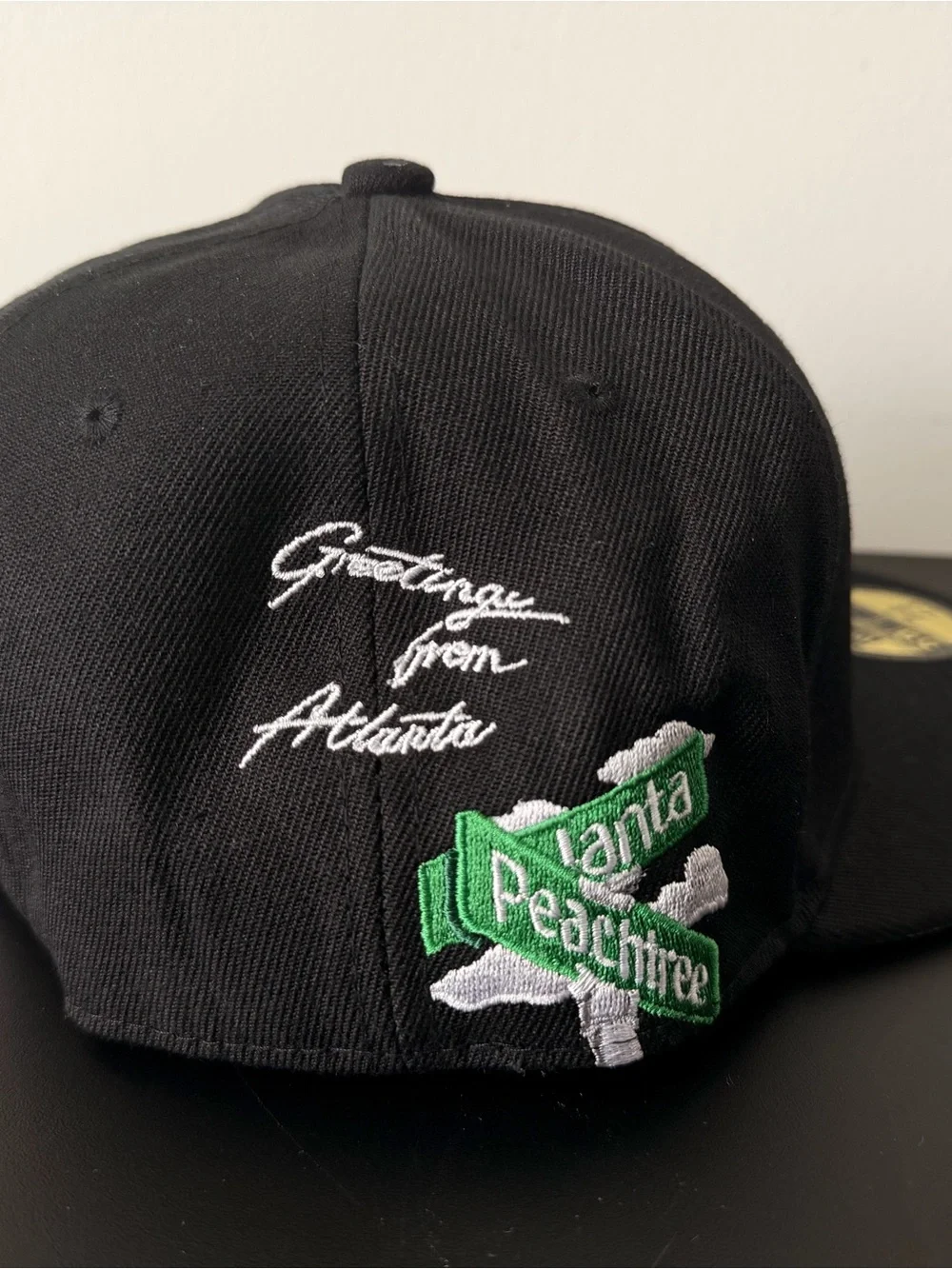 New Era Black Cap with White Script and Green Street Sign Patch